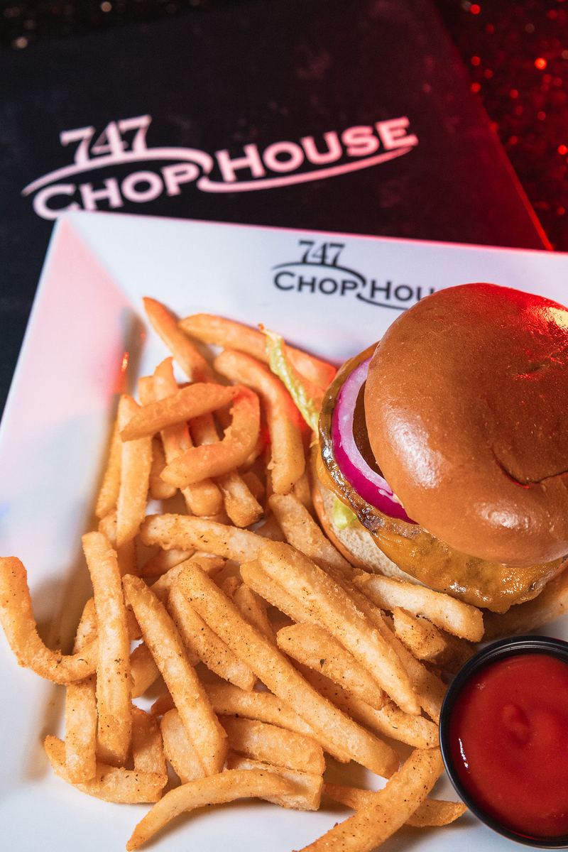 Burger and fries from 747 Chop House, the restaurant inside Capital Cabaret