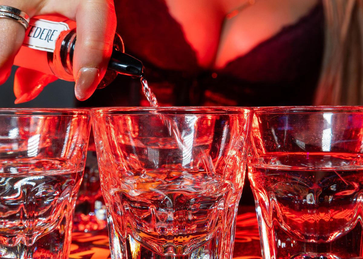 Pouring a round of shots at the Capital Cabaret bar