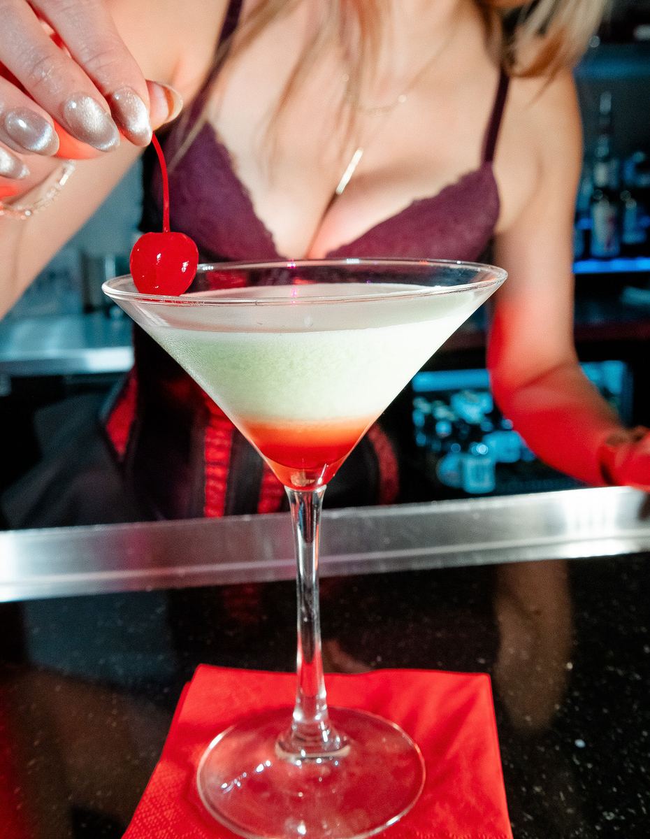 Signature martini with a cherry at the Capital Cabaret bar